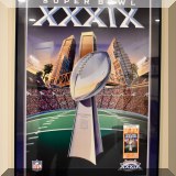 C17. Superbowl XXXIX poster with game ticket. 